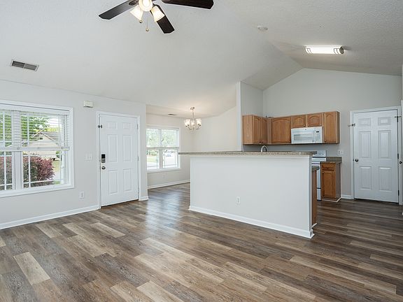 The main living space has a great room feel with the kitchen, dining and living rooms all connected.