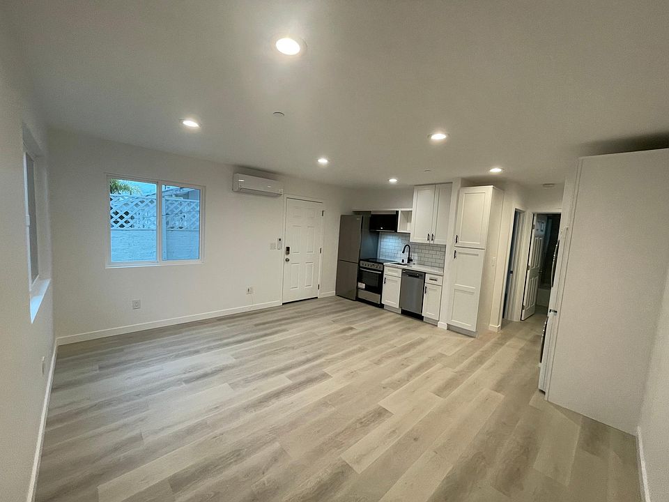 Kitchen and Living Room facing front door.