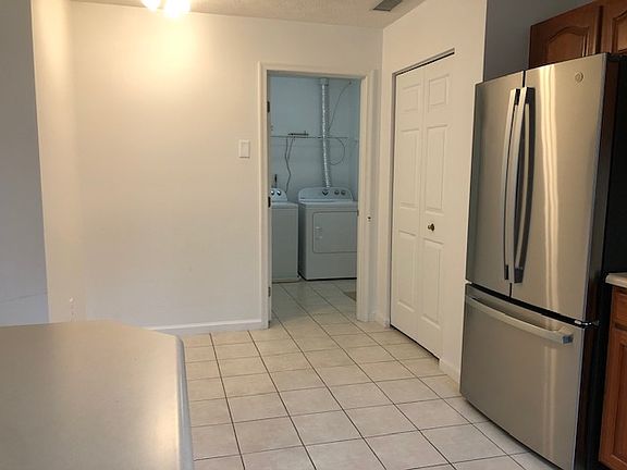 Laundry Room off of Kitchen and Garage. Large Pantry. Eat in kitchen. Refridgerator w/matching Stove Top, Microwave and Dishwasher.