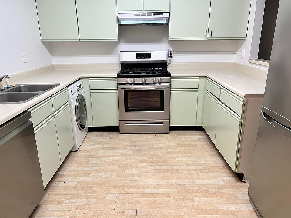 Brand new range, range hood, and refrigerator