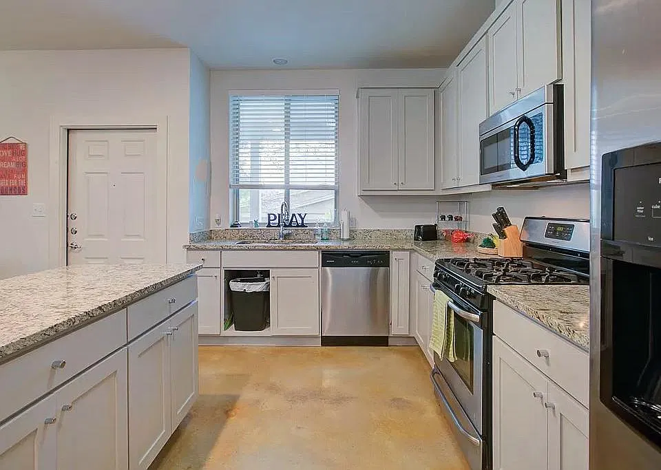 Kitchen with modern appliances and island for more counter space