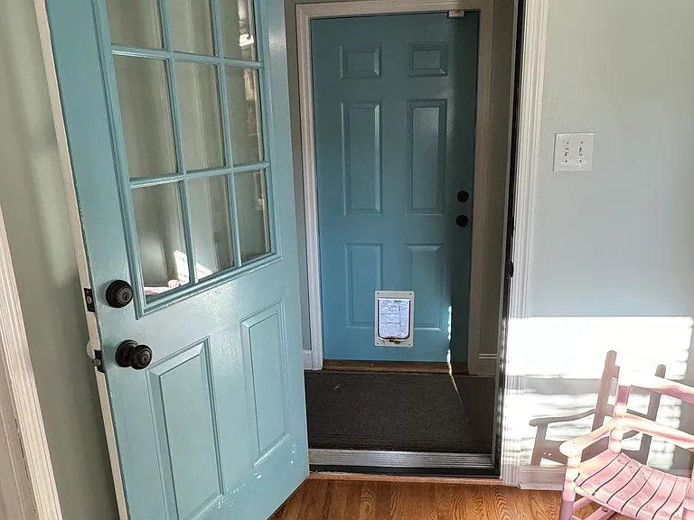 DOOR TO LAUNDRY ROOM AND OUTSIDE TO COVERED PATIO
