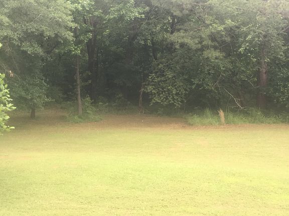 Right of the house, creek. 