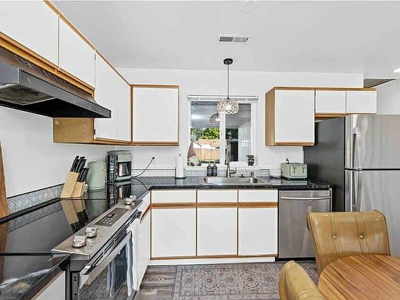 Updated kitchen with stainless steel appliances and plenty of space to cook and gather