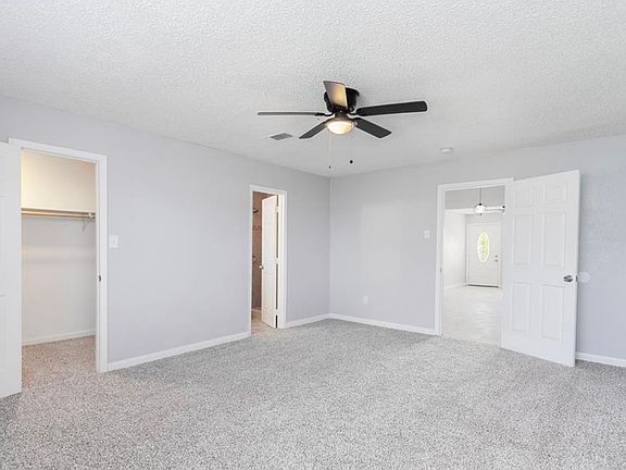 Primary bedroom with full ensuite bathroom, walk-in closet, and private entrance