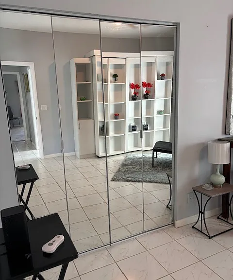 upgraded mirror doors to closets throughout home
