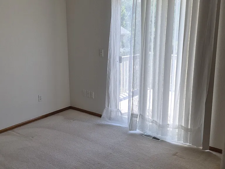 Third bedroom on upper level. Opens onto a deck