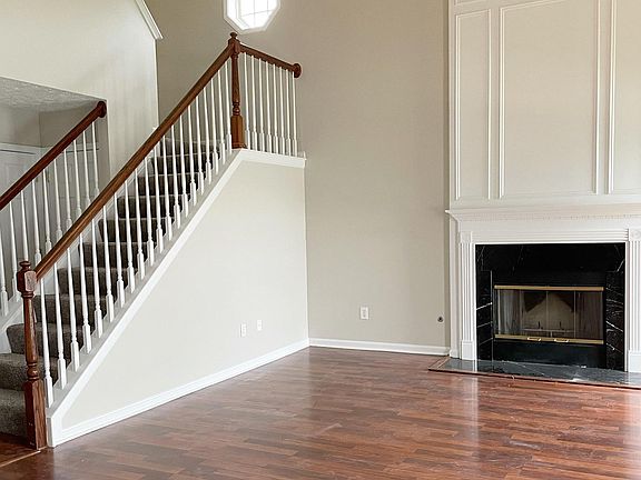 Two story grand room with fireplace.