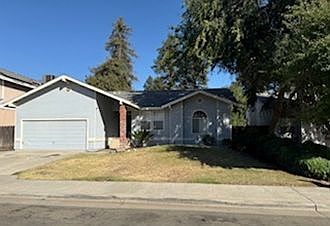 Nicely shaded front of home.