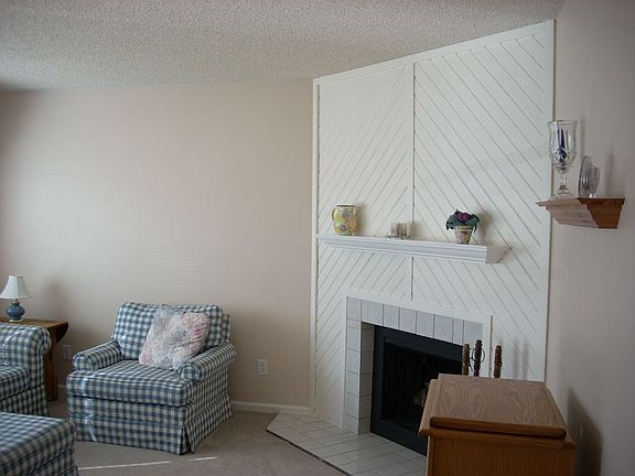 living room with fireplace, very well-kept, tons of natural light
