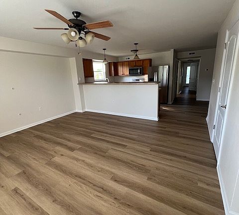 Open floor plan with continuous LVP flooring throughout entire unit.
