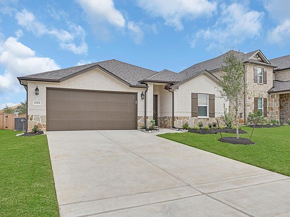 stucco and brick exterior with neutral color pallet.