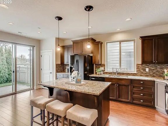 Well-appointed kitchen with granite countertops and effective layout