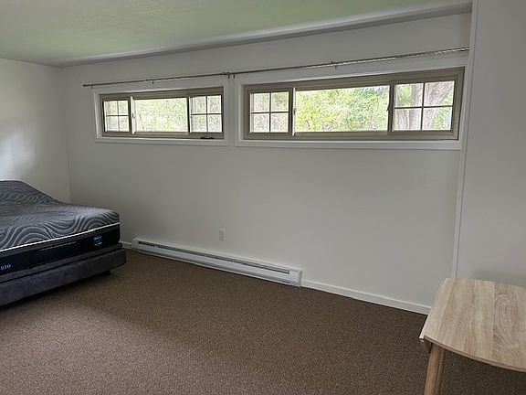 New windows and baseboard heating facing east.