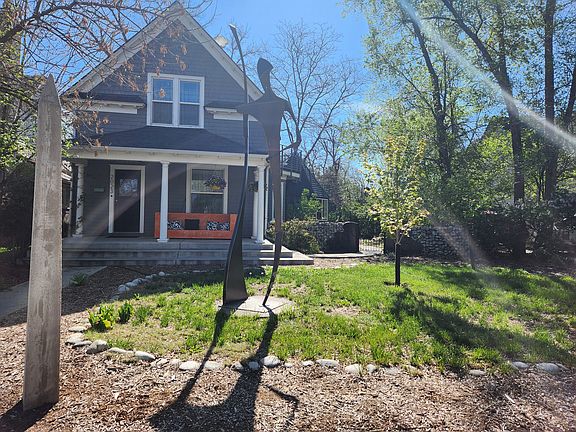 front yard with sculptures