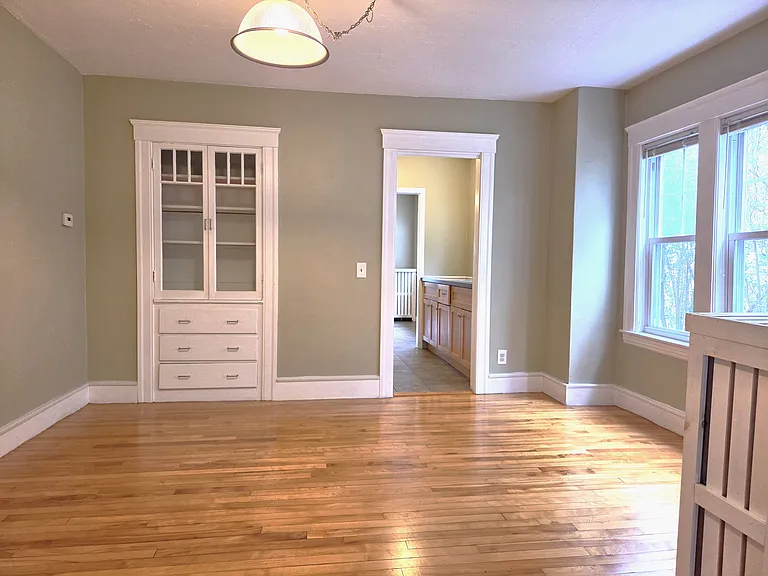 Open dining area between the kitchen and living room.