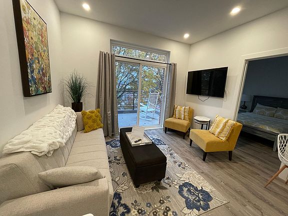 *Photo is from a previously staged model unit. The slider leading to a balcony off the living area is the same.*