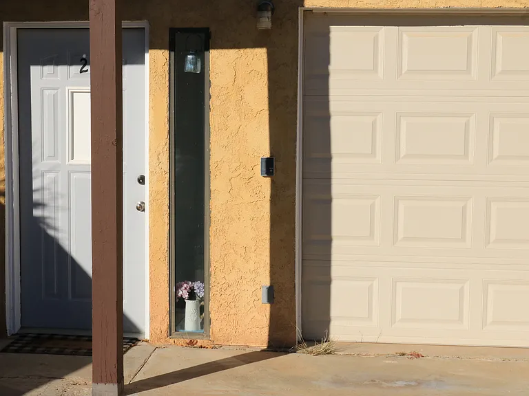 front door and exterior parking area.