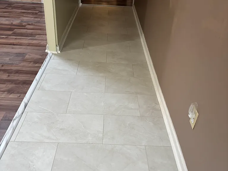 Hallway from Kitchen/Living room into bedrooms. New LVP