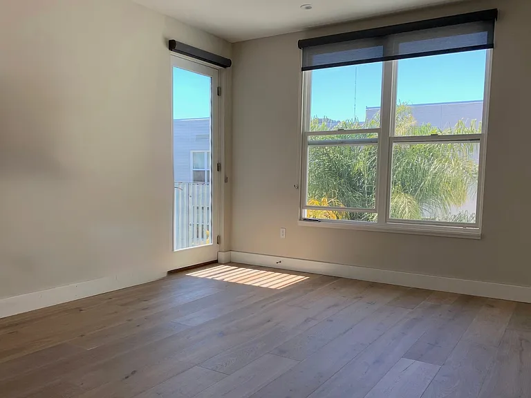 Master Bedroom opens to private patio with lighting.