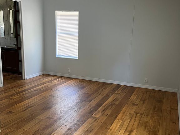 Master bedroom with view of ensuite bath entry.