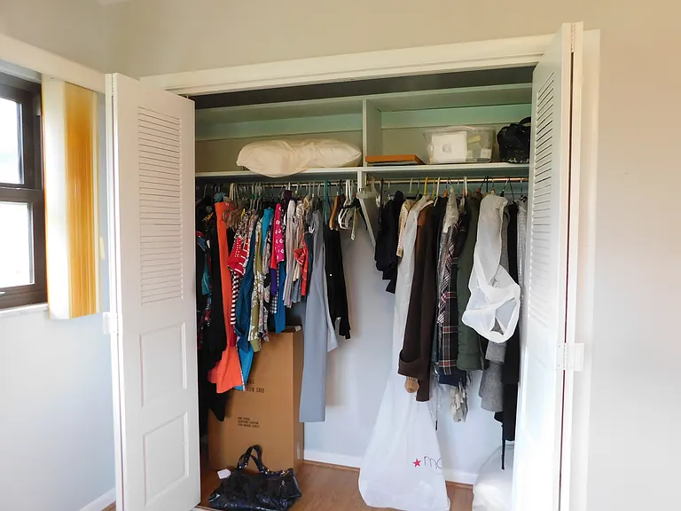 The southeast bedroom closet is approximately 7.3' x 2.1'. Clothes aren't included! We're now facing west.