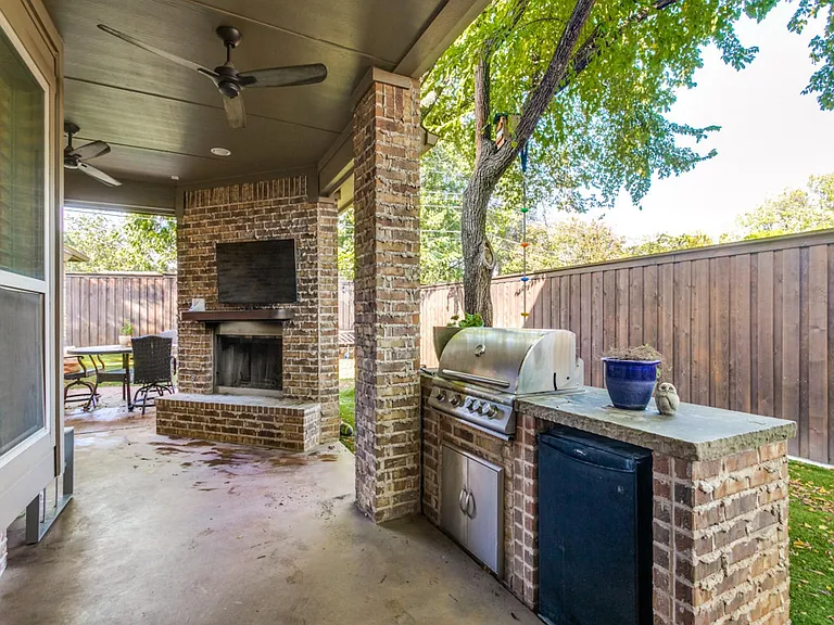 Covered Back Patio with Fireplace And Built-In Gas Grill
