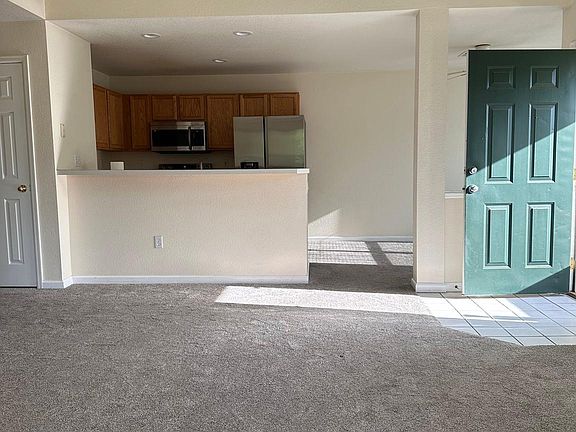 Living room and kitchen. Dining area is to the right of the kitchen.