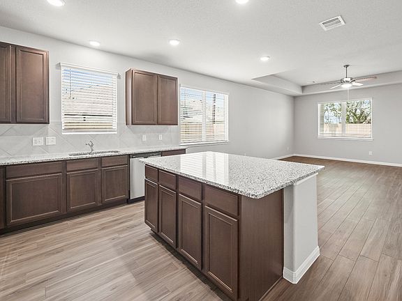 Kitchen to Dining Area and Family Room