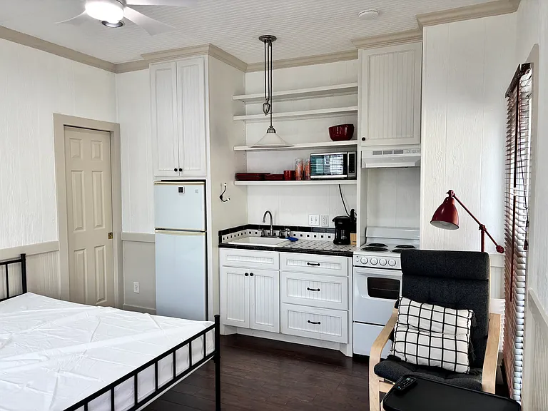 View from the entrance. Fully stocked kitchenette. Chair for relaxing or studying. Full size bed with memory foam mattress.