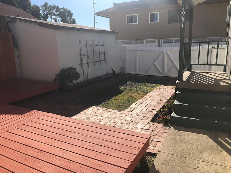 Large sliding gate access to the alley