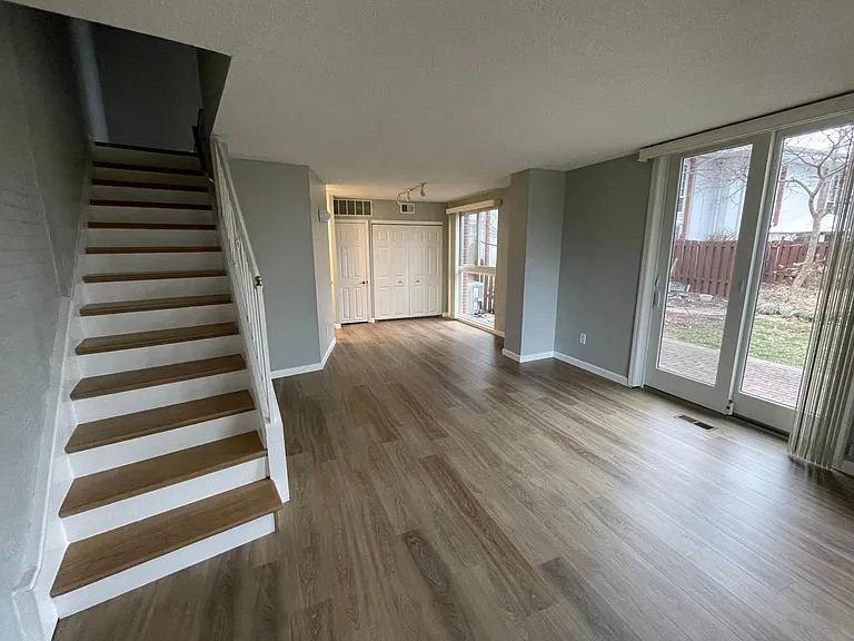 view from entrance into living room and dining area.
