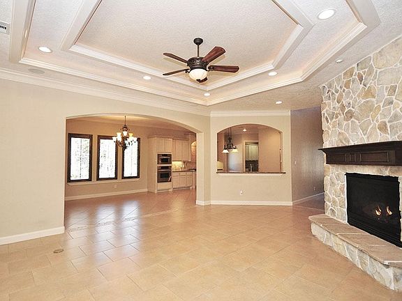 Lovely living room with stone accented gas fireplace with raised hearth.  Remote controlled for instant fire.