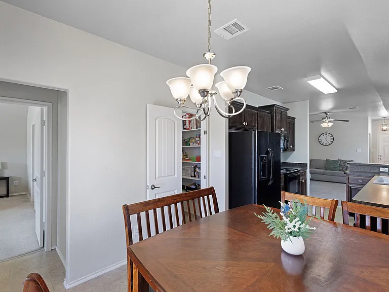 View of the dining area looking toward the kitchen and walk-in pantry