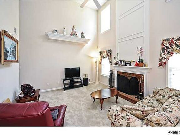 Two story Great Room with Gas Fireplace and NEW carpet:Lots of light