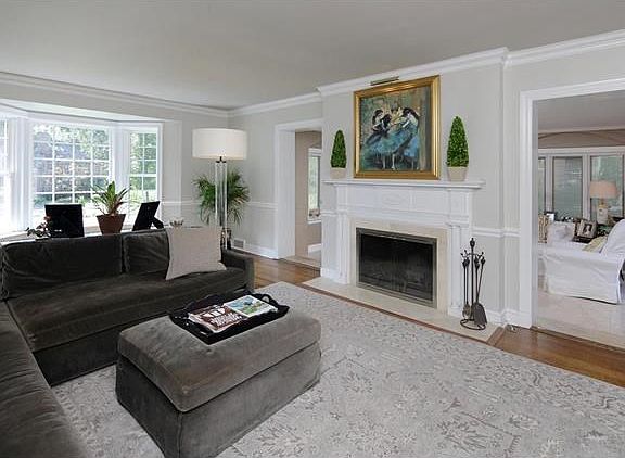 Bright Living Room with wood burning fireplace