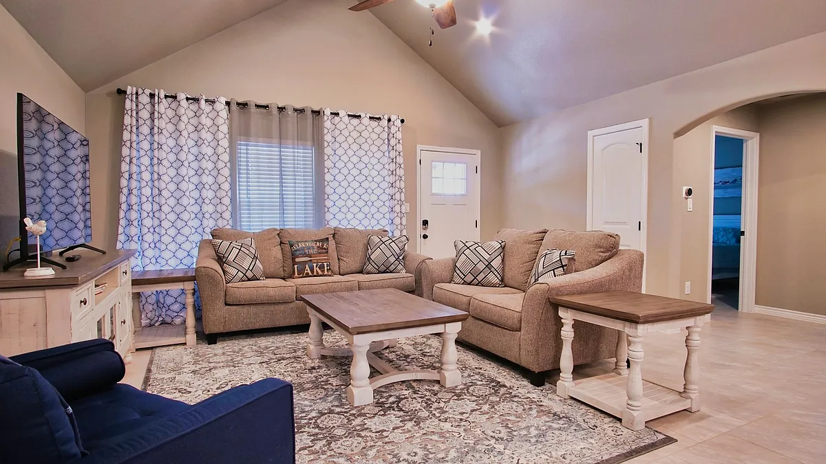 Comfortable open-concept living room flowing seamlessly into the dining area and kitchen. - 2299 Westview Dr