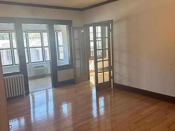 LR looking into sunroom - glass door leads do DR and kitchen/pantry