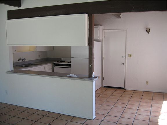 Living room looking into Kitchen with new tile floors