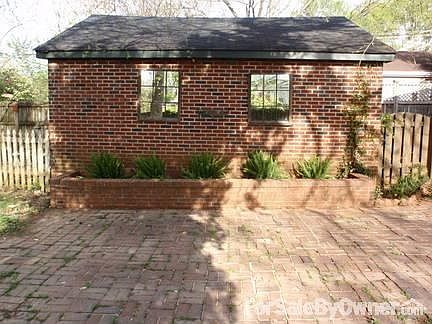 Kitchen
						:
						Cherry cabinetry, Corian counters and saltillo tile floor.