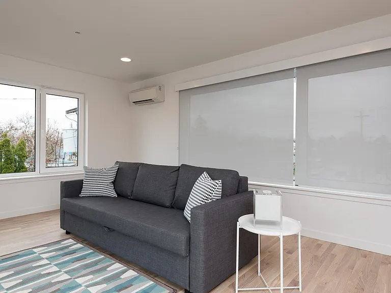 Fourth floor Family Room (or 5th Bedroom) with fireplace, balcony and wet-bar