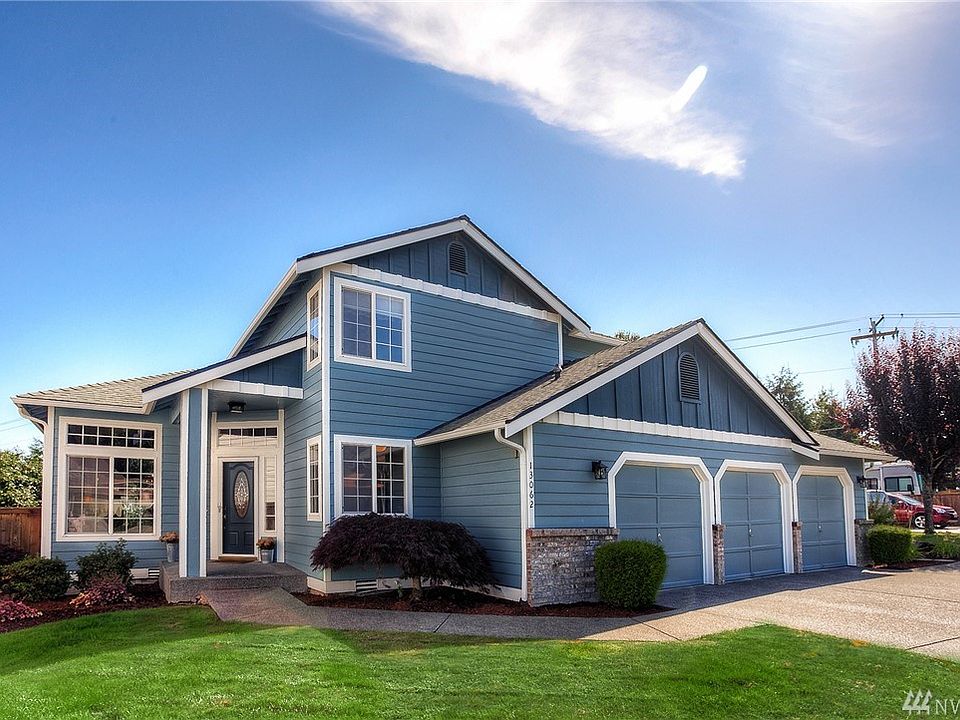 Peaceful New Exterior paint and mature landscaping. 3 car garage with built in storage 