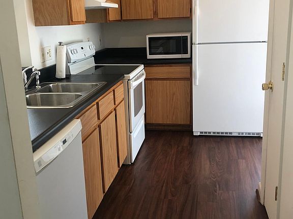 Full eat-in kitchen with microwave, full sized fridge, dishwasher and pantry.
