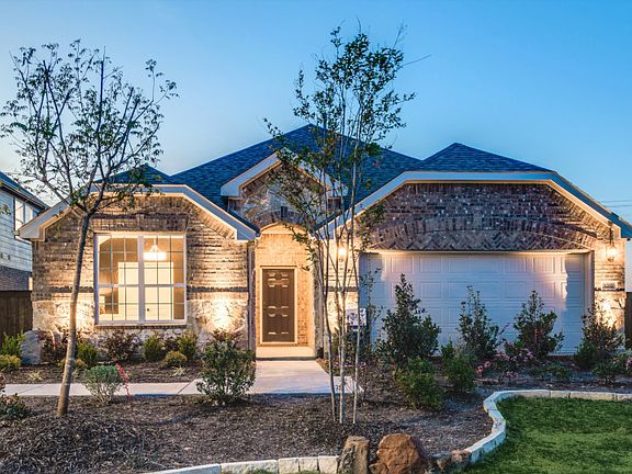 The Mckinney, a one-story home with 2-car garage, shown with Home Exterior C