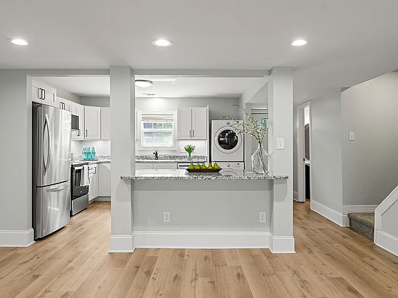 Kitchen and stairs to 2nd floor