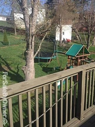 back yard
						:
						large swing set next to the pool, as seen from kitchen deck