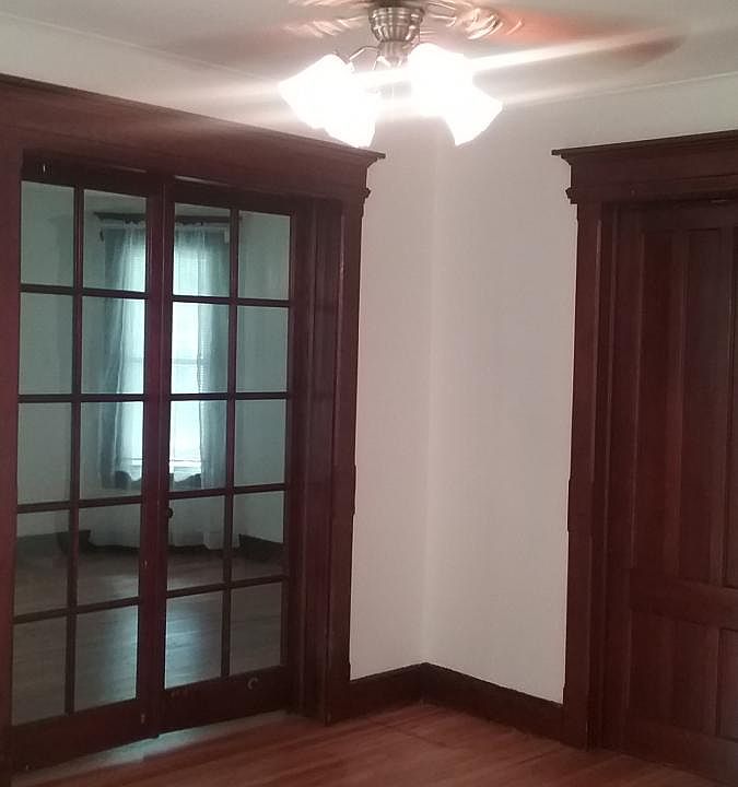 Living room with double glass doors all hardwood tons of light, mini blinds included.