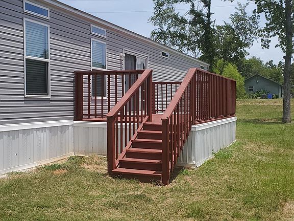 Back of house showing deck