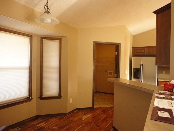 Looking from the eating bar towards the laundry room that leads out to the garage