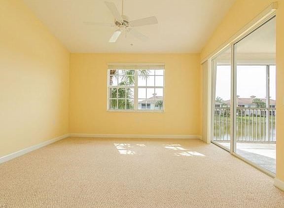 Large master bedroom with lake and fountain view